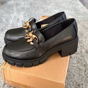 Madden NYC Elegant Black Loafers with Gold chain